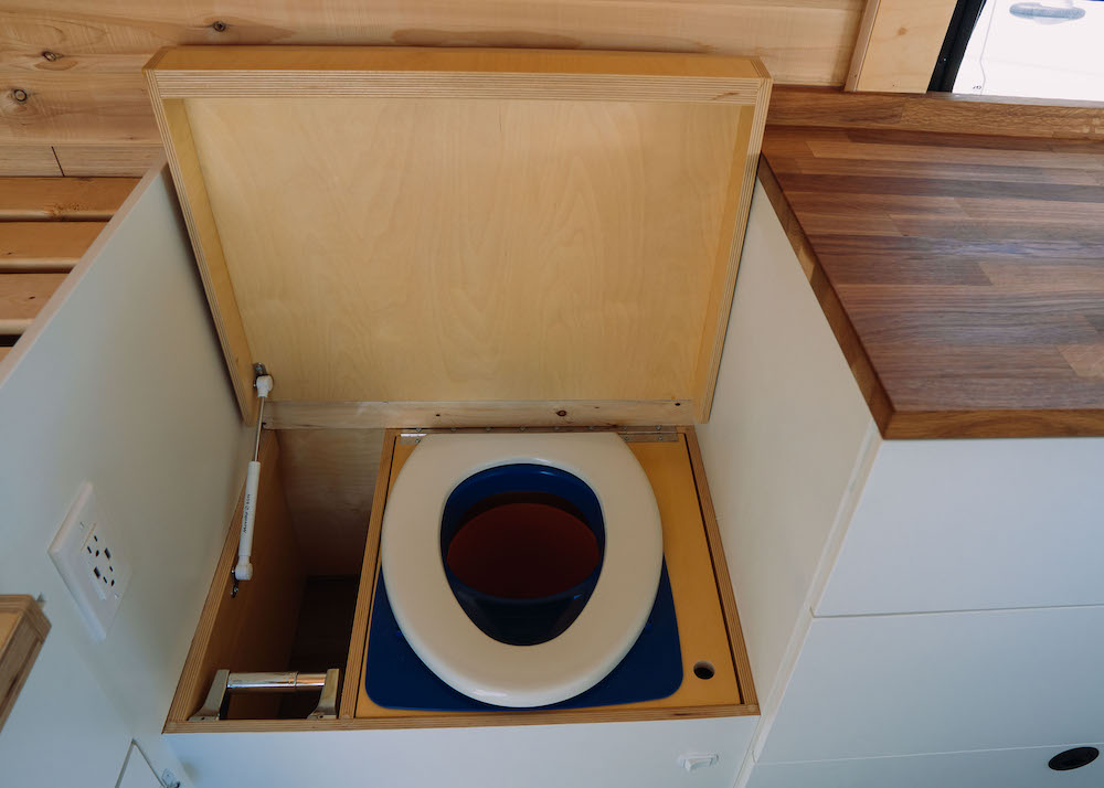 toilet seat in vanlife bathroom