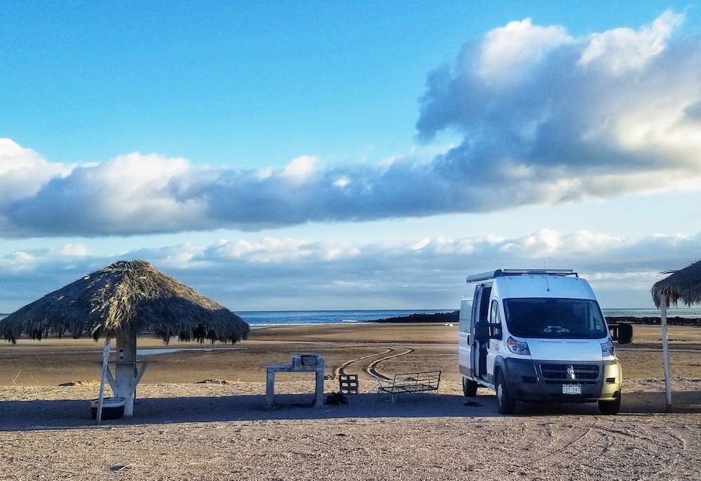 van parked on beach - choose your new van