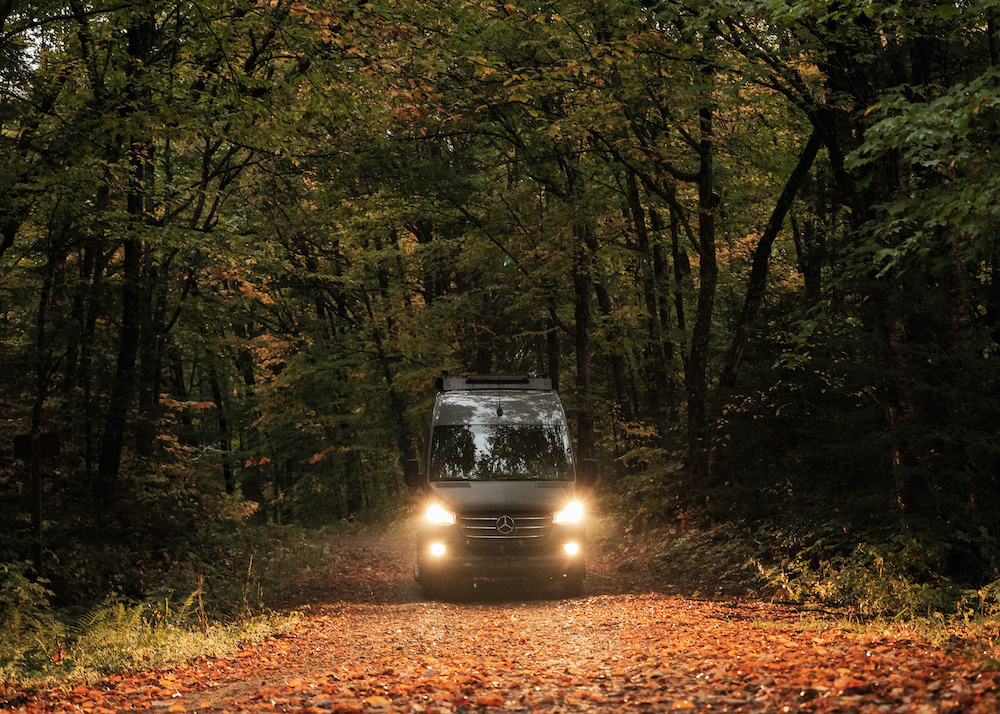 van driving through leaves - la van life automnale