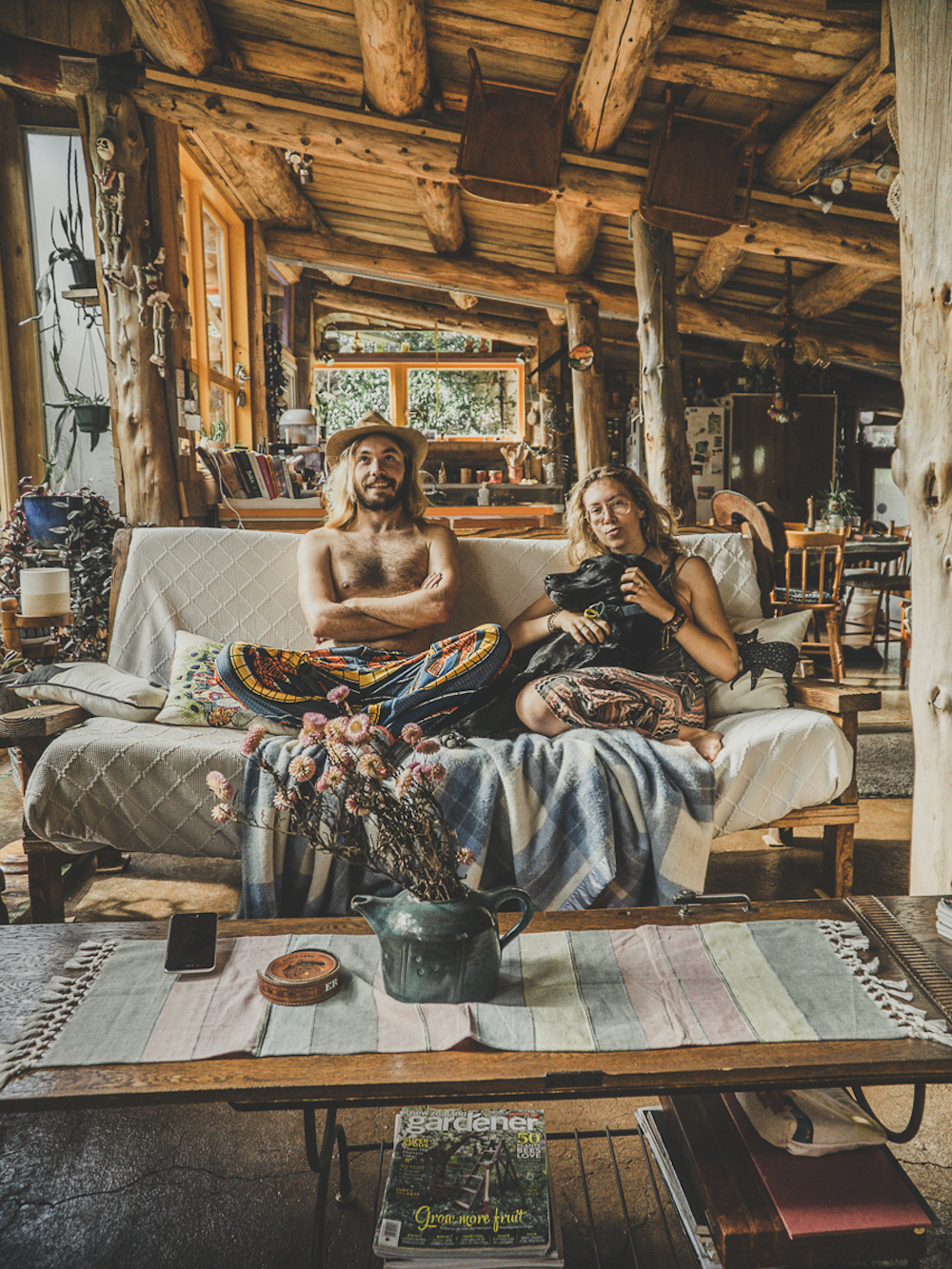 couple sits on couch - responsible vanlife