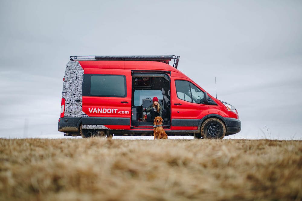 red van girl and pup - van life travel