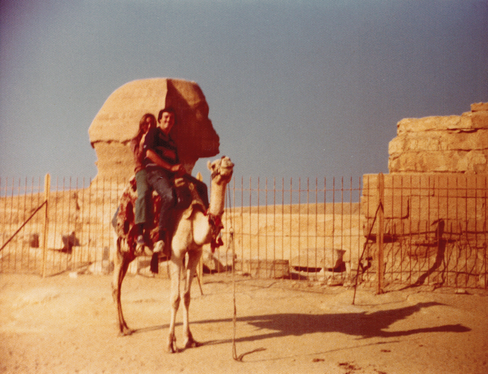 couple riding on camel - tripping 1975