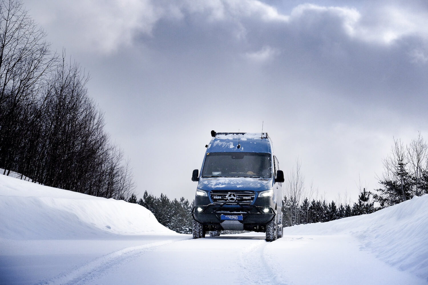 140 wheelbase blue sprinter van in snow